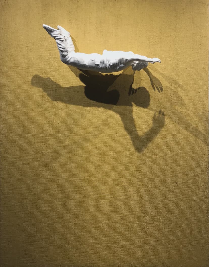 End of Blocks by Federico Clapis: a white figure in mid-dive emerges from a mustard yellow canvas, casting a sharp shadow