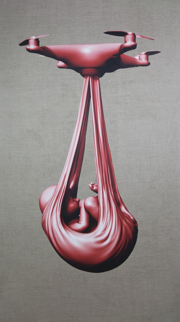 Red babydrone by Federico Clapis: large red image of an infant in a cloth sling carried by a drone, on raw grey canvas