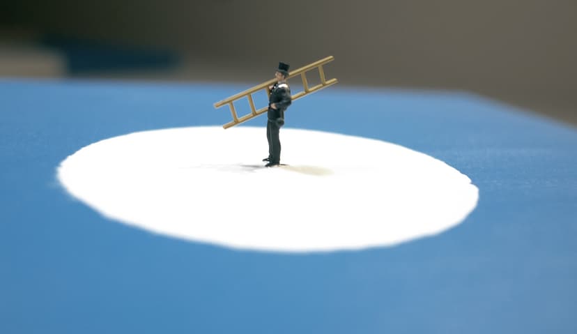 The Lord by Federico Clapis, close-up of a tiny chimney sweep in a top hat carrying a ladder on a white circle over blue canvas