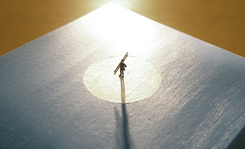 The Lord by Federico Clapis, the miniature chimney sweep with ladder standing in a pale circle on a blue canvas in warm light