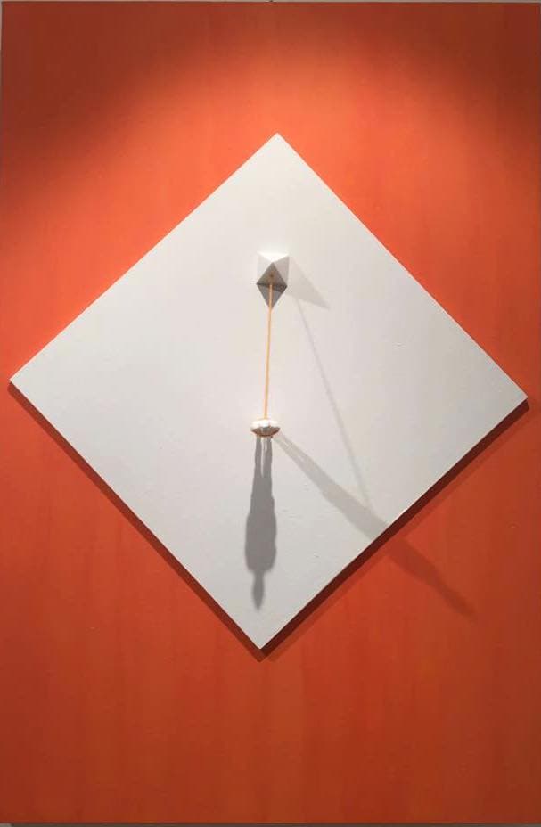 The Pyramid by Federico Clapis: white diamond-shaped panel on orange canvas, a figure tethered to a pyramid by an orange thread