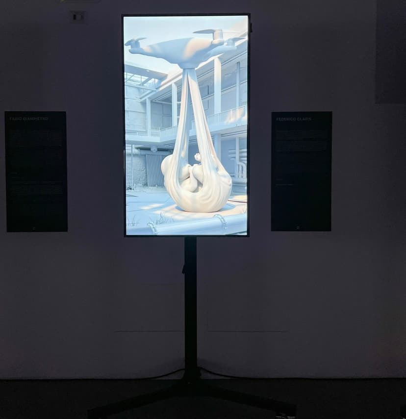 Federico Clapis' Babydrone image, a drone carrying a baby in a sling, on a vertical screen at DART Dynamic Art Museum in Milan, between text panels