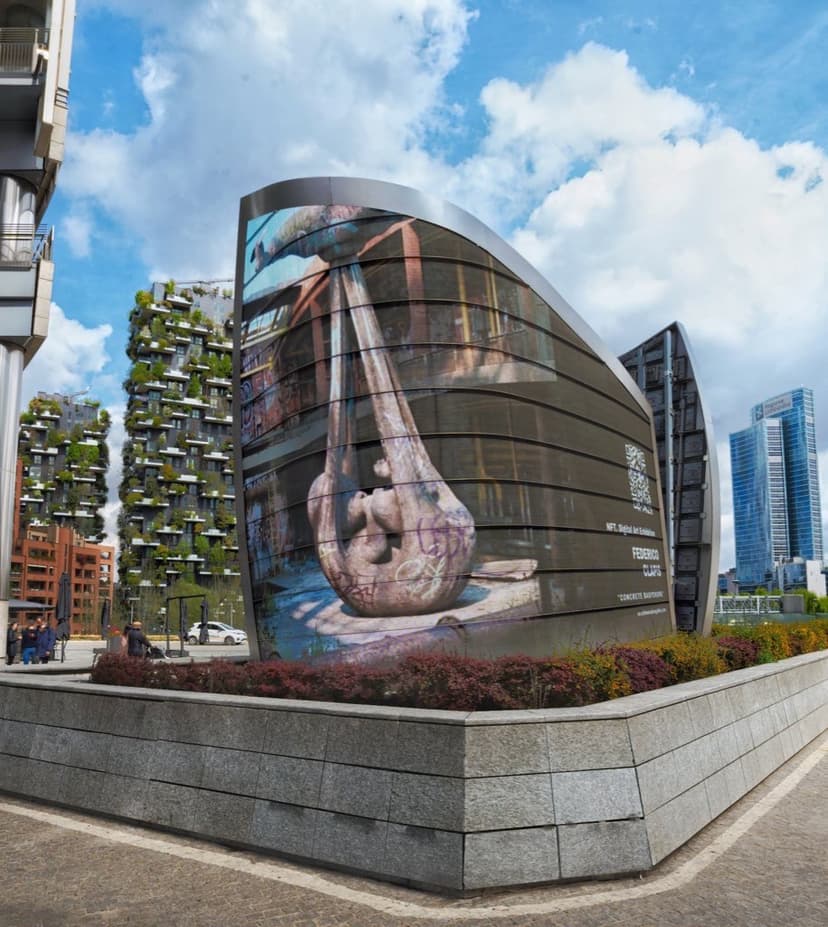 Concrete Babydrone by Federico Clapis on a curved LED sail in Piazza Gae Aulenti, Milan, with the Bosco Verticale towers behind