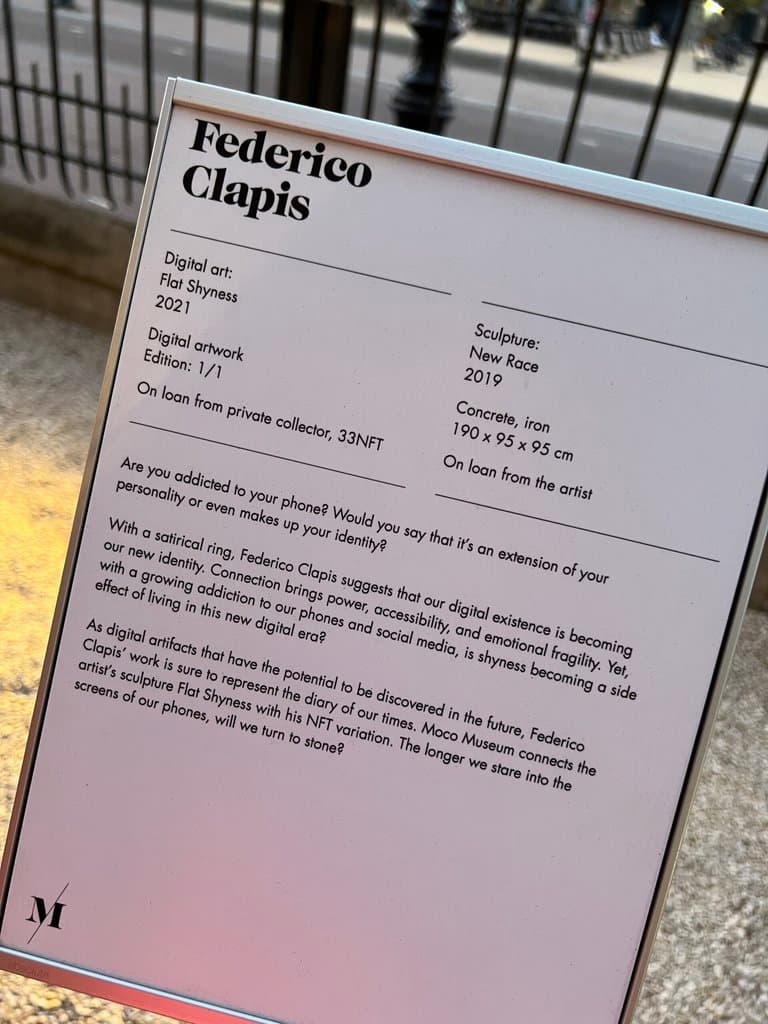 Moco Museum Amsterdam label for Federico Clapis, presenting the NFT Flat Shyness and the concrete sculpture New Race side by side