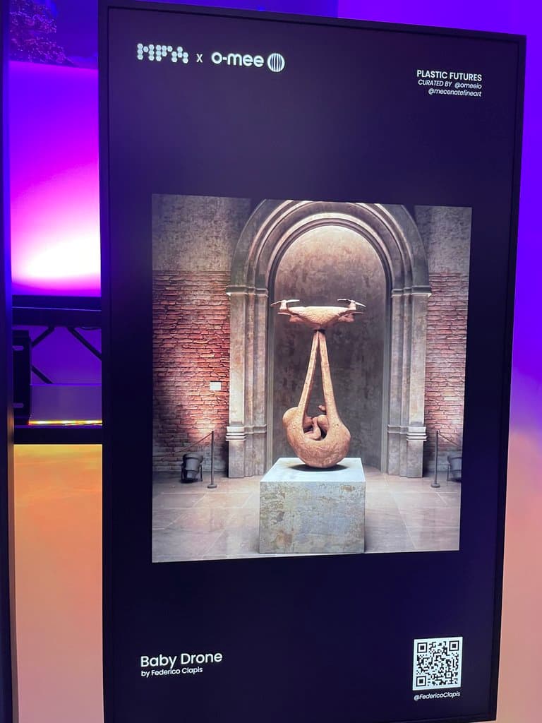 Vertical screen at Plastic Futures, Mecenate Fine Art in Rome, showing Baby Drone by Federico Clapis, a terracotta drone carrying a newborn
