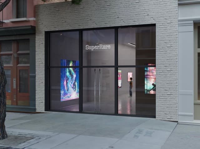 Street view of the SuperRare Gallery storefront in SoHo, New York, with digital screens behind the glass, venue of a show including Federico Clapis